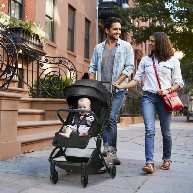 parents with their baby in baby stroller