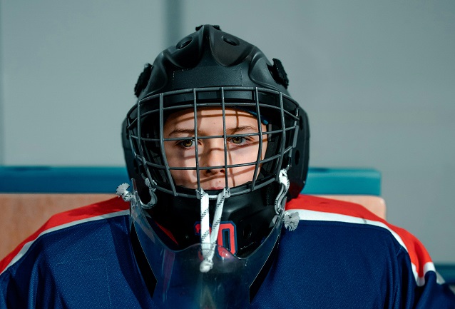hockey player wears a helmet