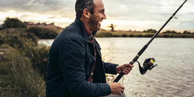 a happy person fishing in a lake