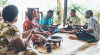 people sitting and singing songs